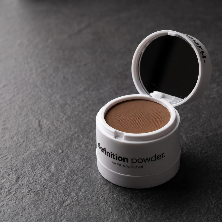 Definition powder compact open with its mirror and pressed powder