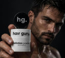 Man holding the Hair Guru London definition powder