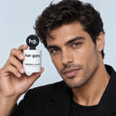 Man holding the Hair Guru London definition powder